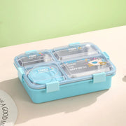 Blue bento box with compartments on a light beige surface