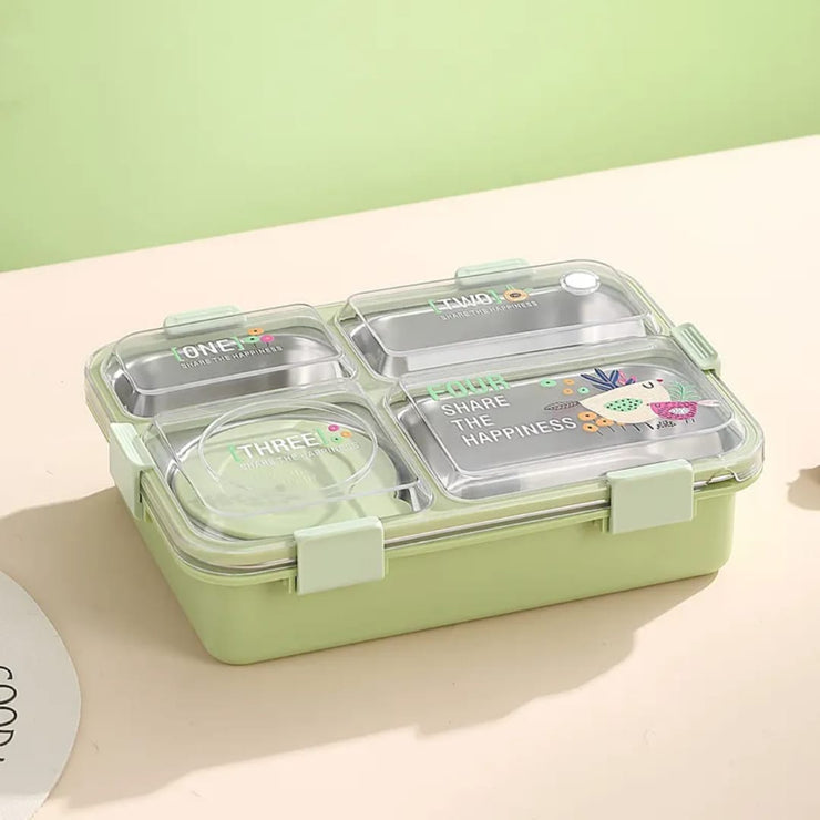 Green bento box with compartments on a light beige surface