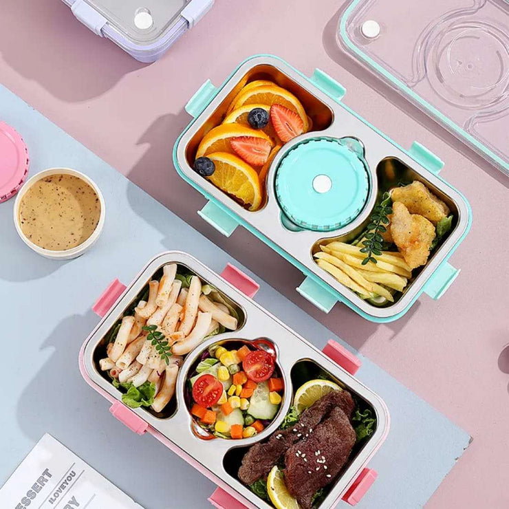 Two bento boxes with various foods on a colorful background