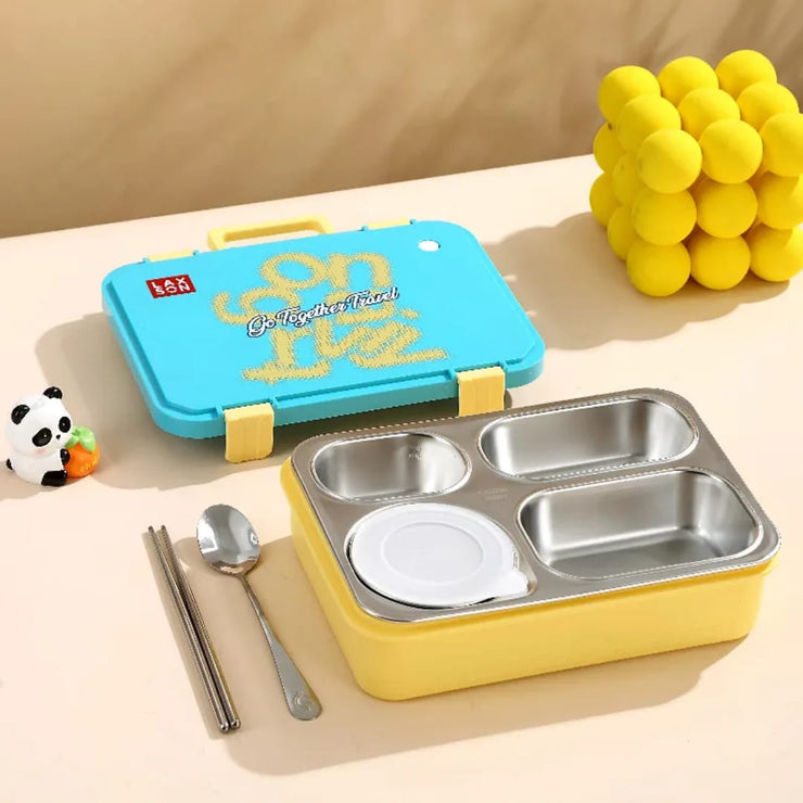 Bento box with compartments, spoon, and fork on a beige surface with a yellow ball and panda toy in the background.