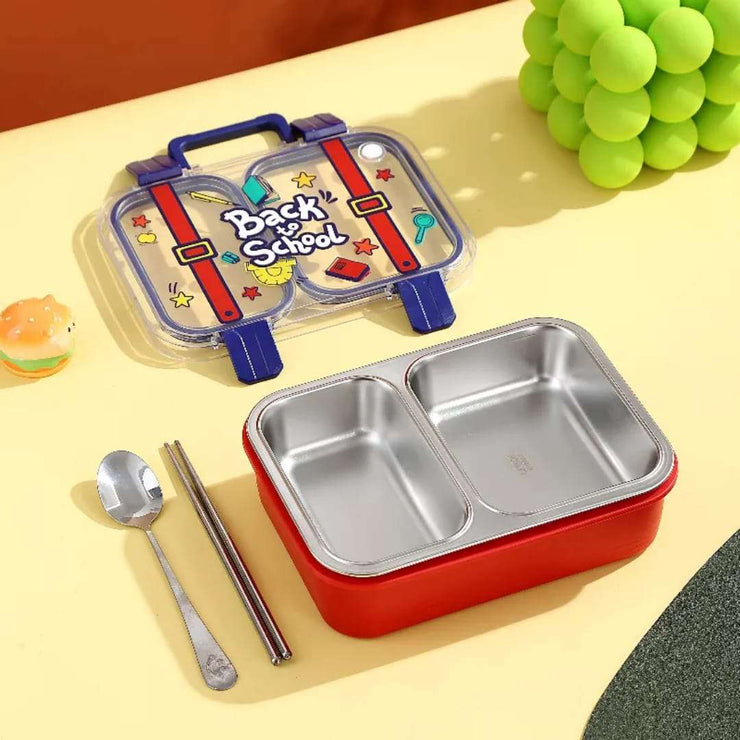 Red lunch box with compartments, spoon, and chopsticks on a yellow surface with a 'Back to School' themed container.