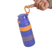 Purple water bottle with orange accents held by a hand on a white background