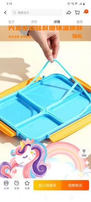 Colorful children's lunch box with compartments held by a hand, featuring a cartoon unicorn and rainbow design.