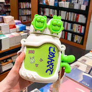 Green and white container with cartoon character design held in front of a bookshelf.
