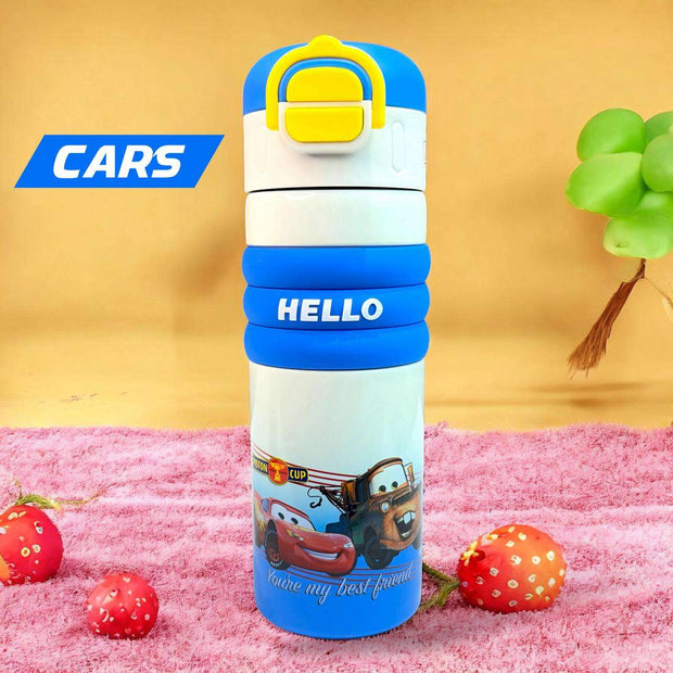 Children's water bottle with Disney Cars design on a pink surface with strawberries.