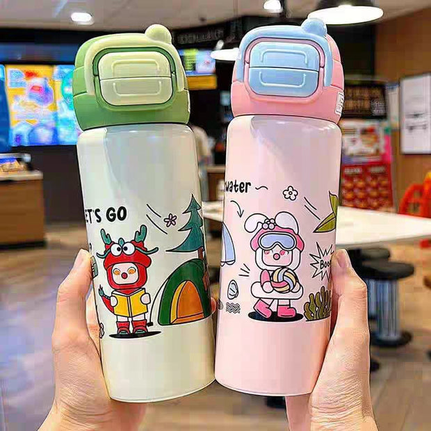 Two cartoon-themed water bottles held in a casual setting.