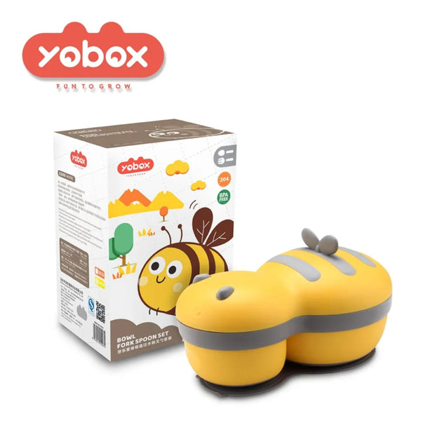 Yellow bee-shaped toy with gray stripes next to its packaging on a white background, featuring the Yobox brand.