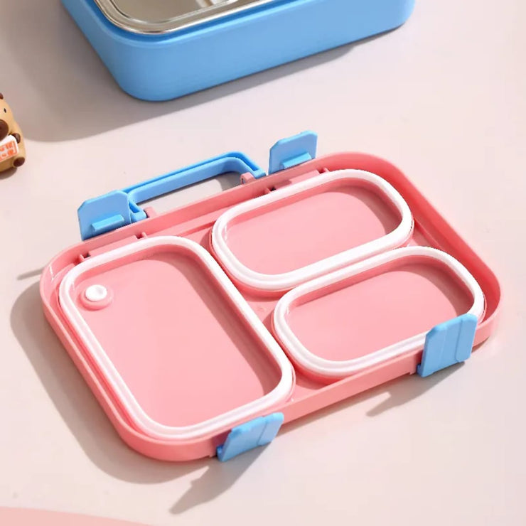 Pink and blue bento box on a light surface
