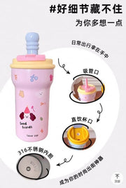 Children's cup with multiple features highlighted on a white background